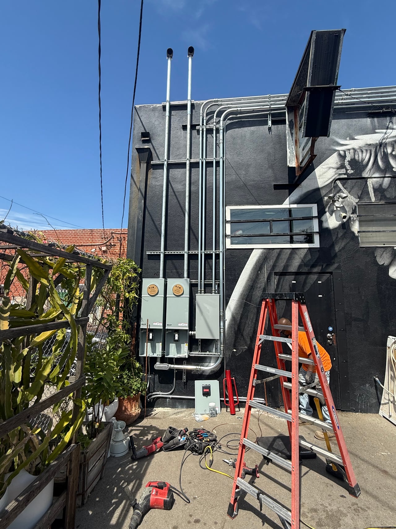 Exterior meter panels and conduit at Goldline Bar in Los Angeles