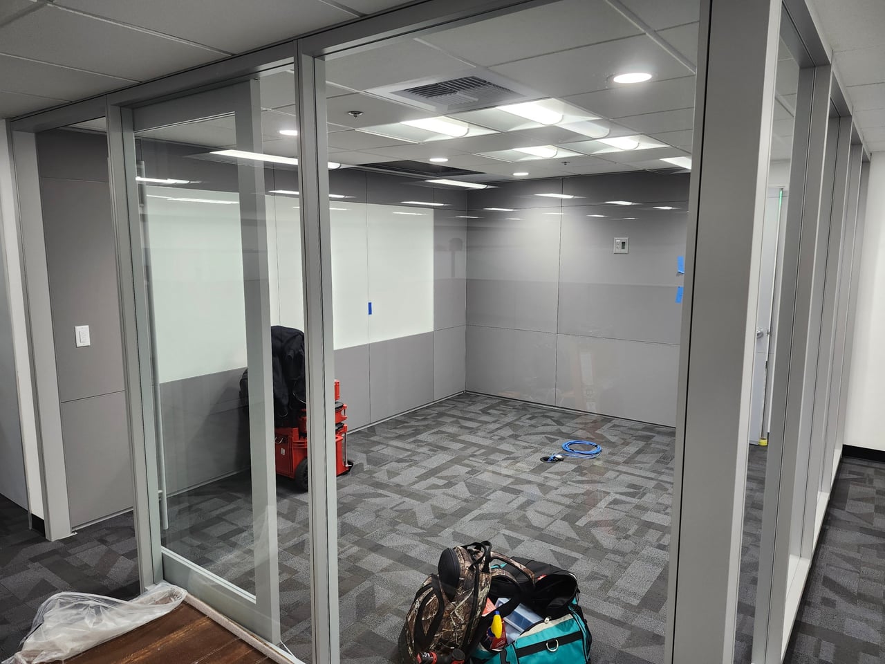 Ceiling lighting in a glass-walled office at Marvin Engineering in Inglewood