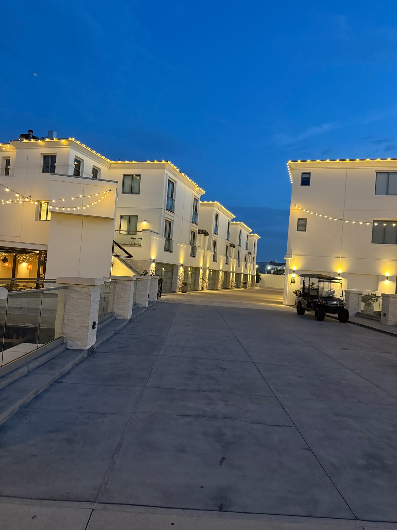 Residential buildings and illuminated shared walkways at Peninsula Village